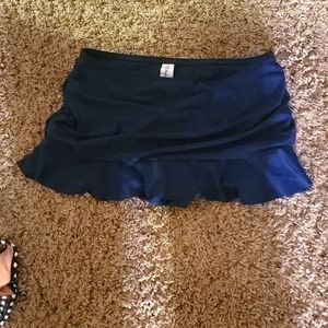 Woman's navy blue ruffled swim skirt